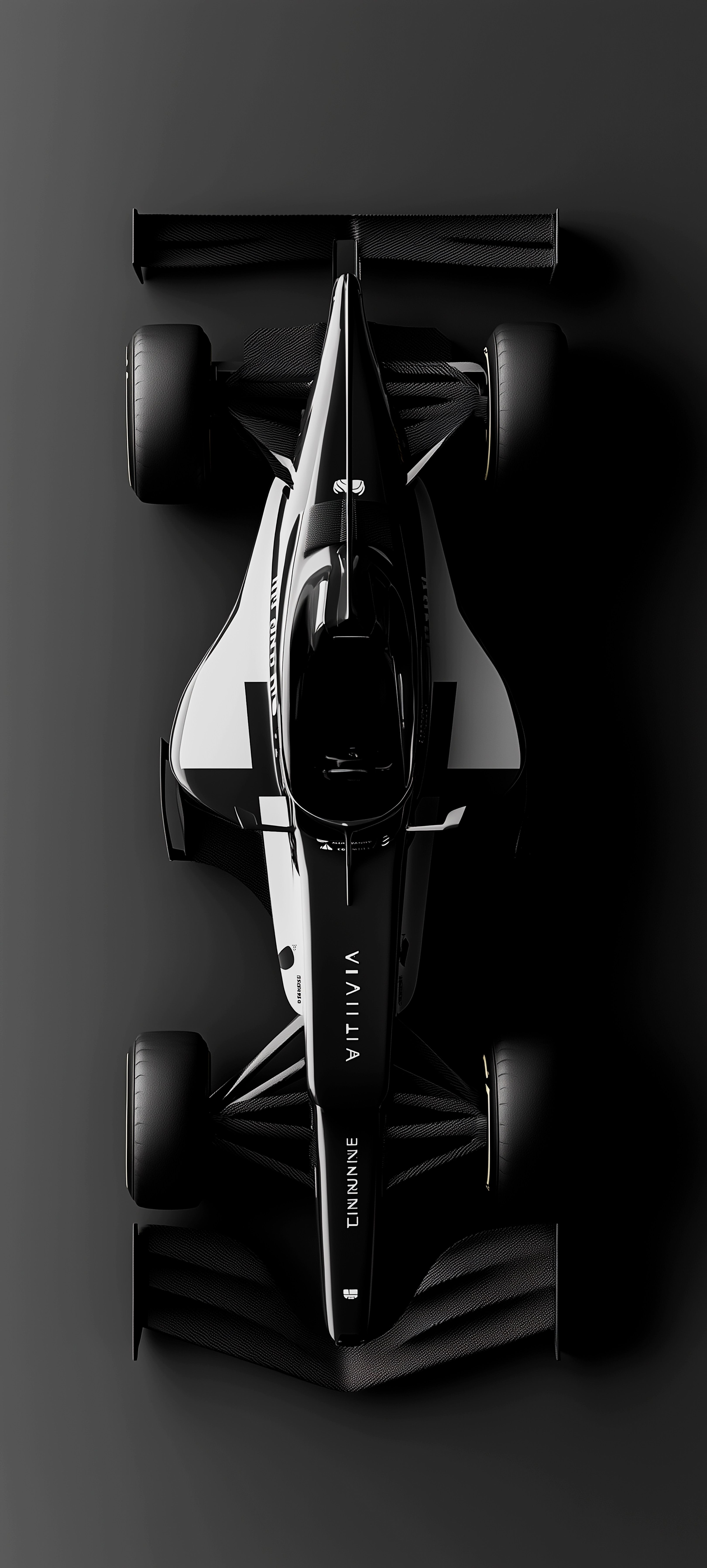 a black and white photo of a racing car on a dark background, viewed from above