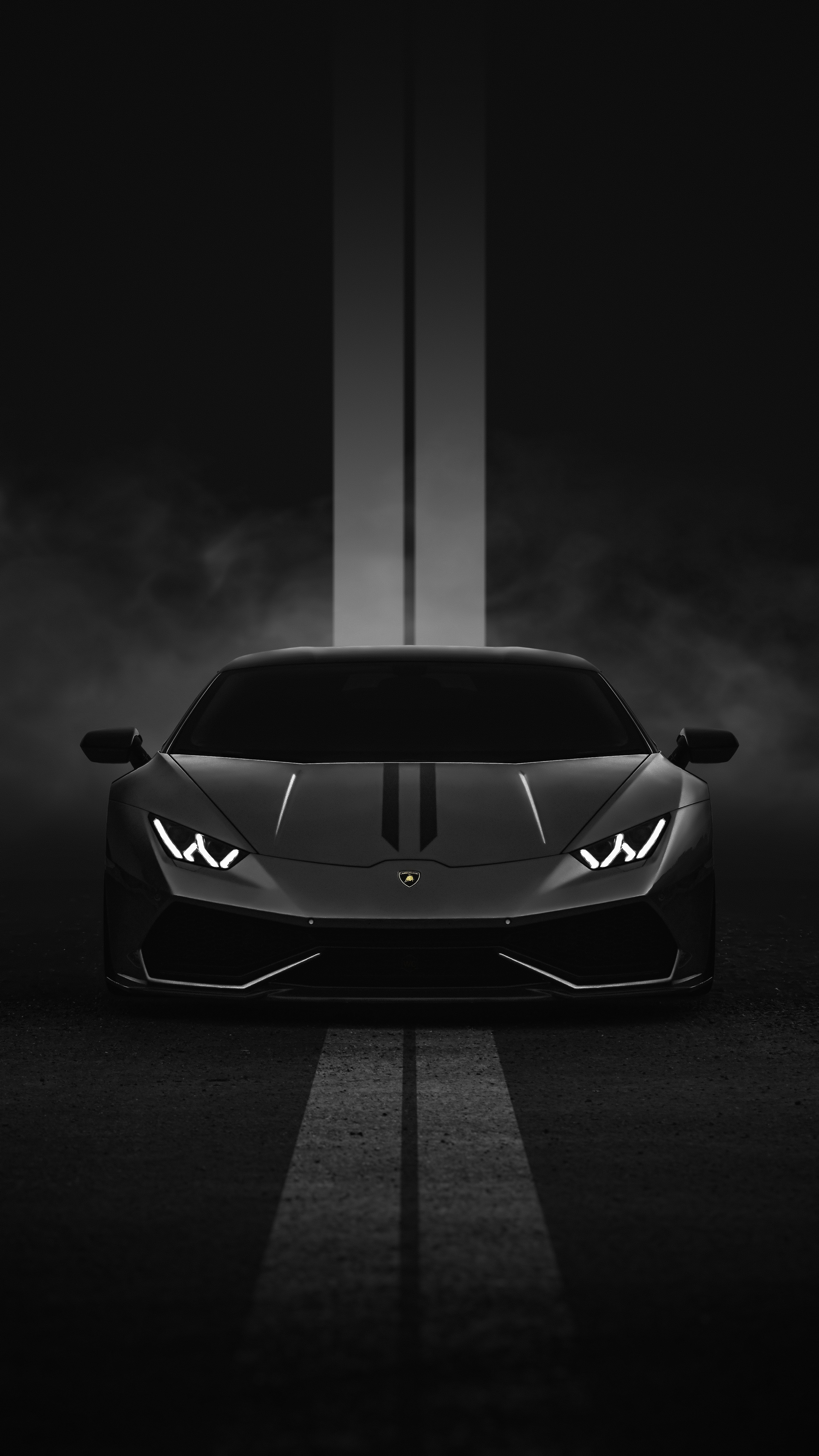 a black and white photo of a sports car