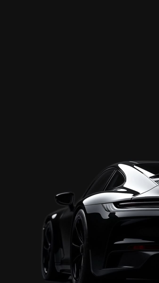 a black sports car is shown in the dark