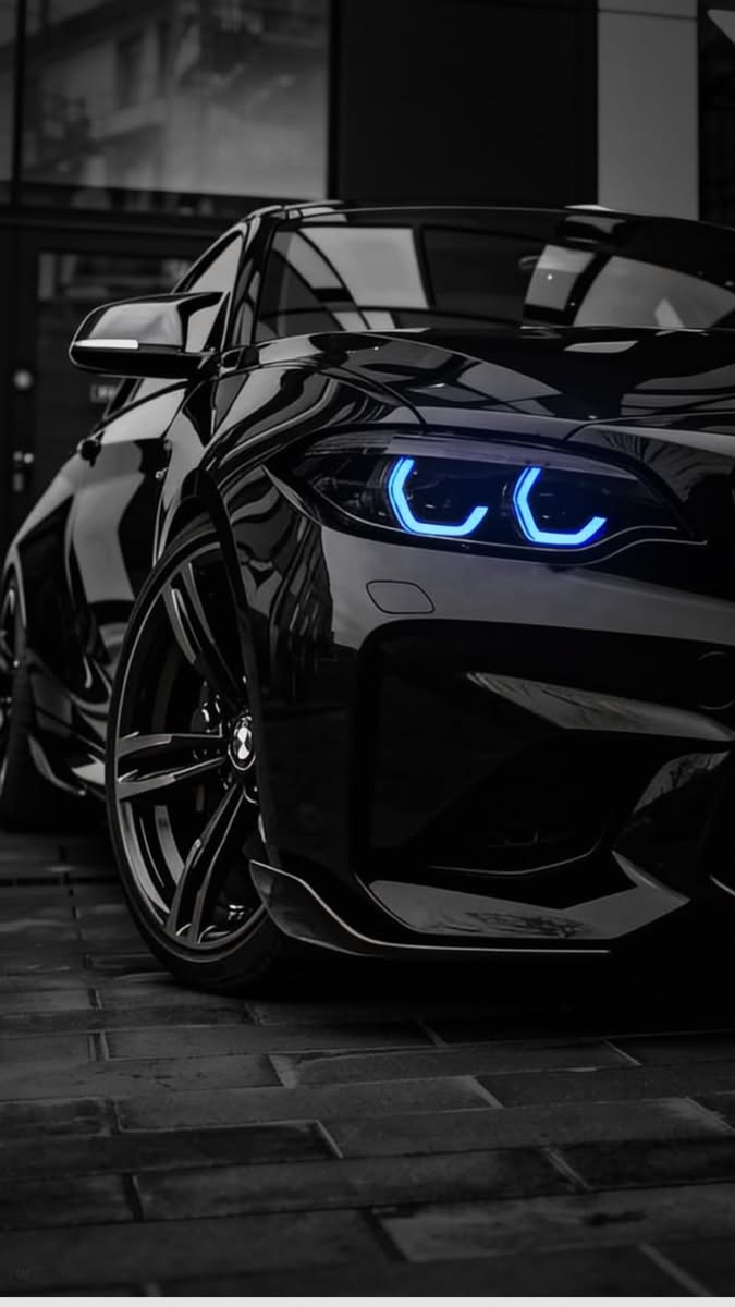 a black sports car with glowing blue eyes