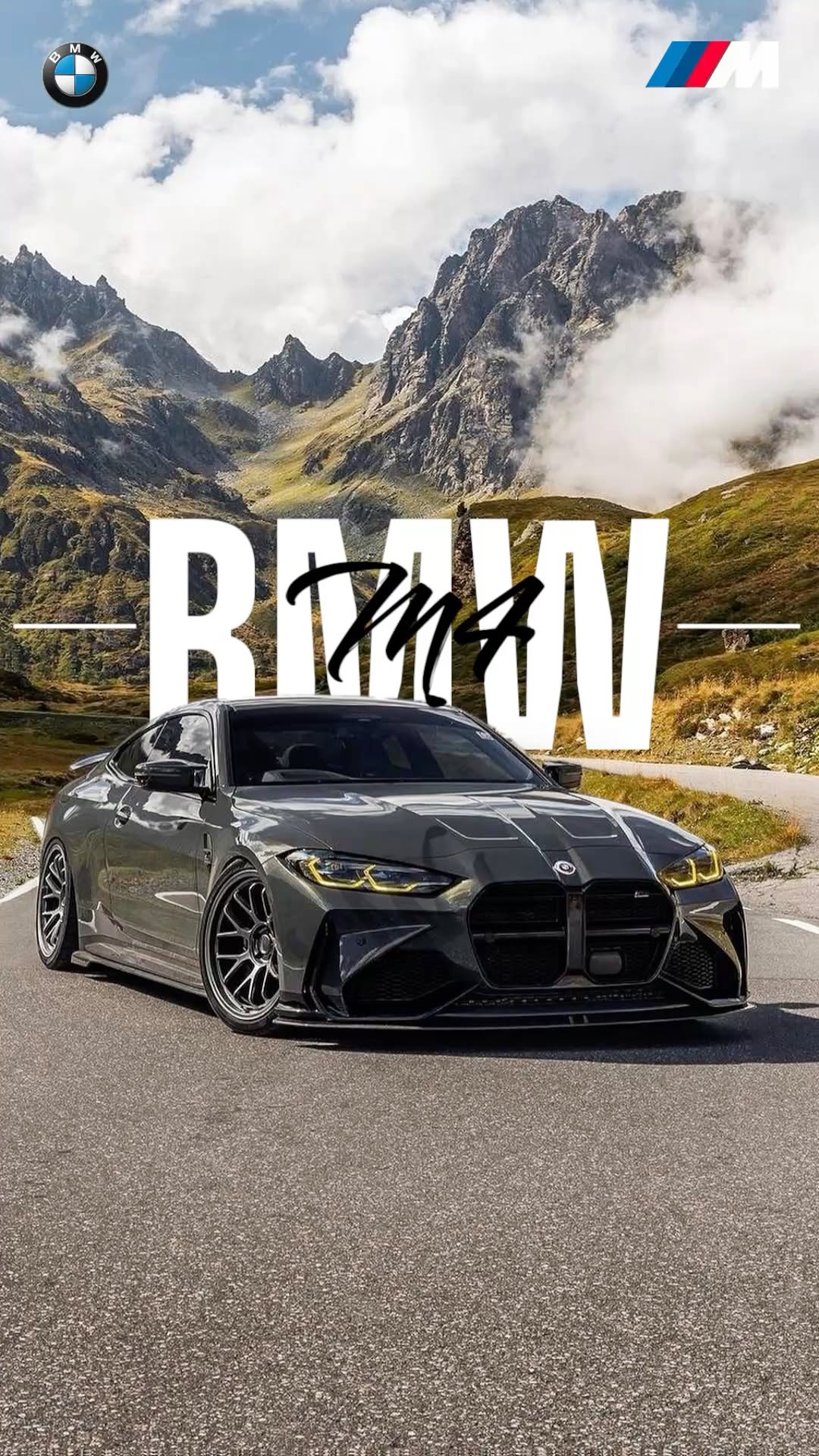 a car driving down a road next to mountains