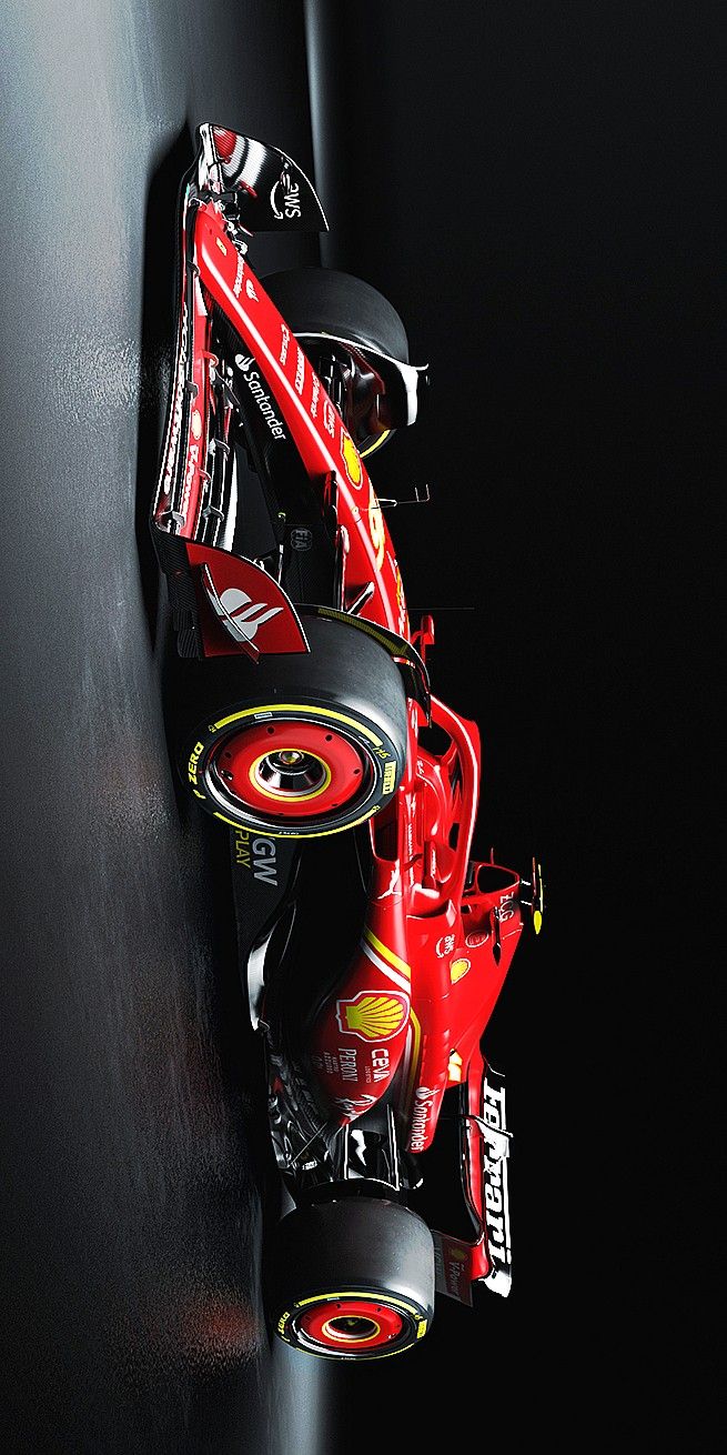 a red race car is leaning against the wall