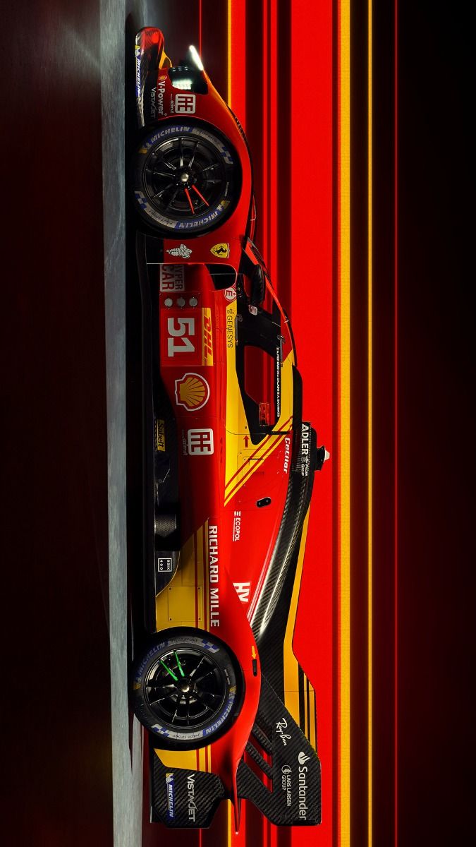 a red race car parked on the side of a wall with wheels hanging from it's sides