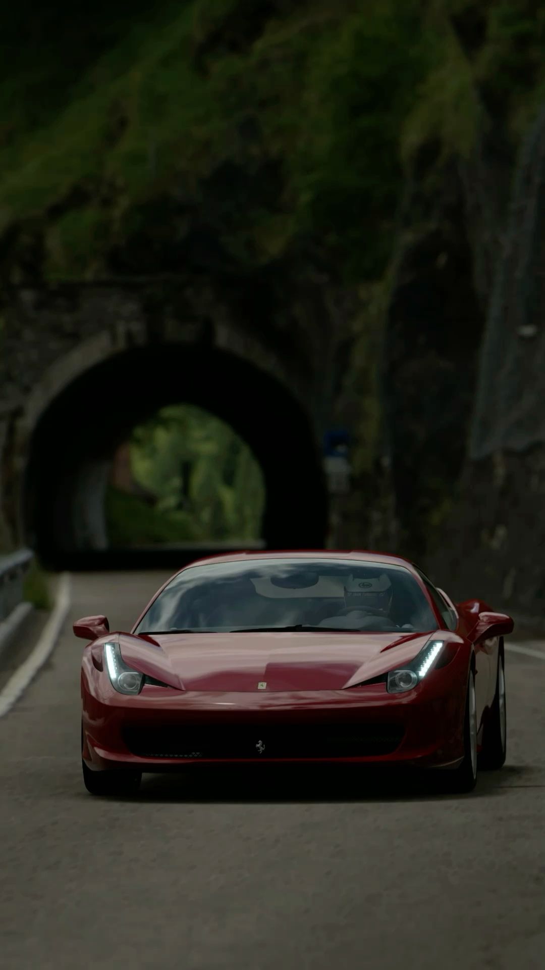 a red sports car driving through a tunnel