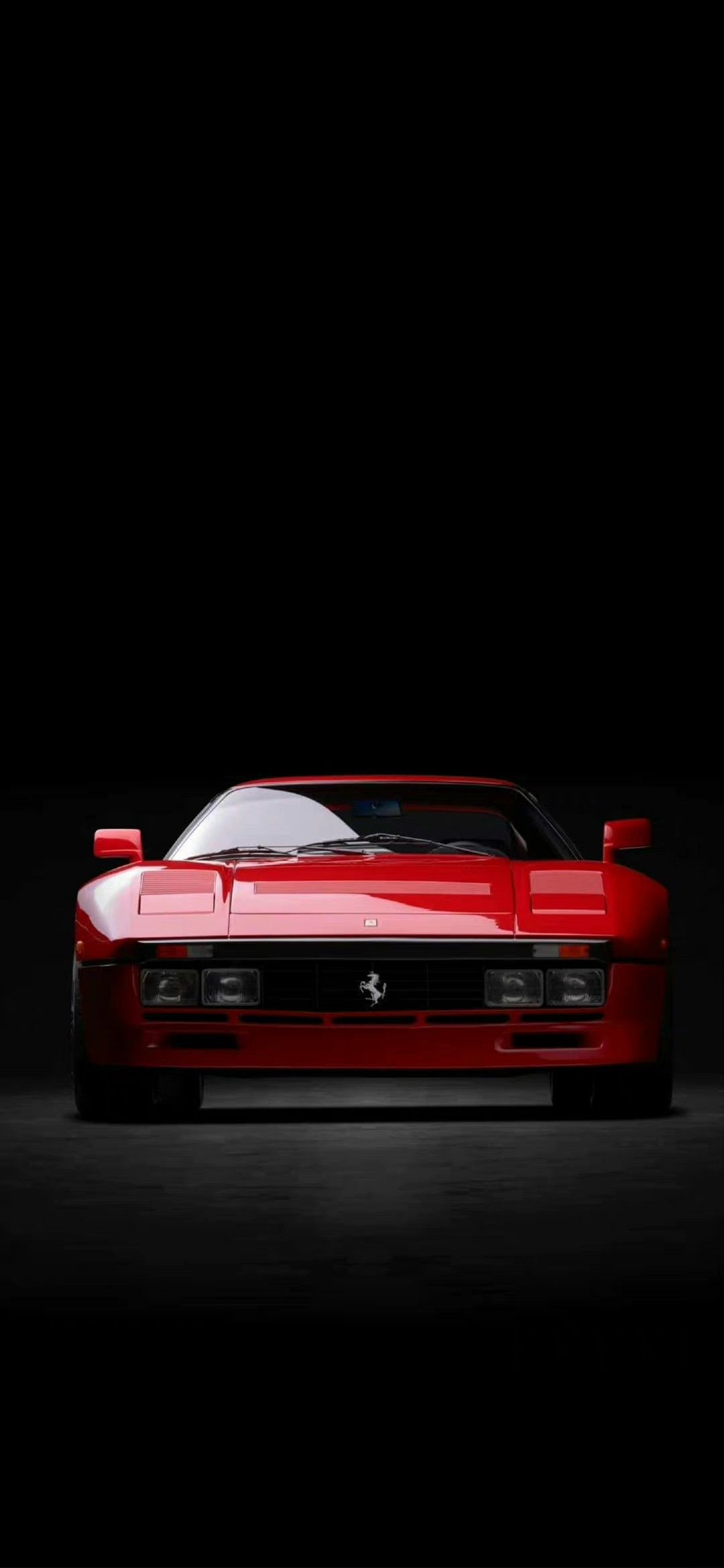 a red sports car is shown in the dark