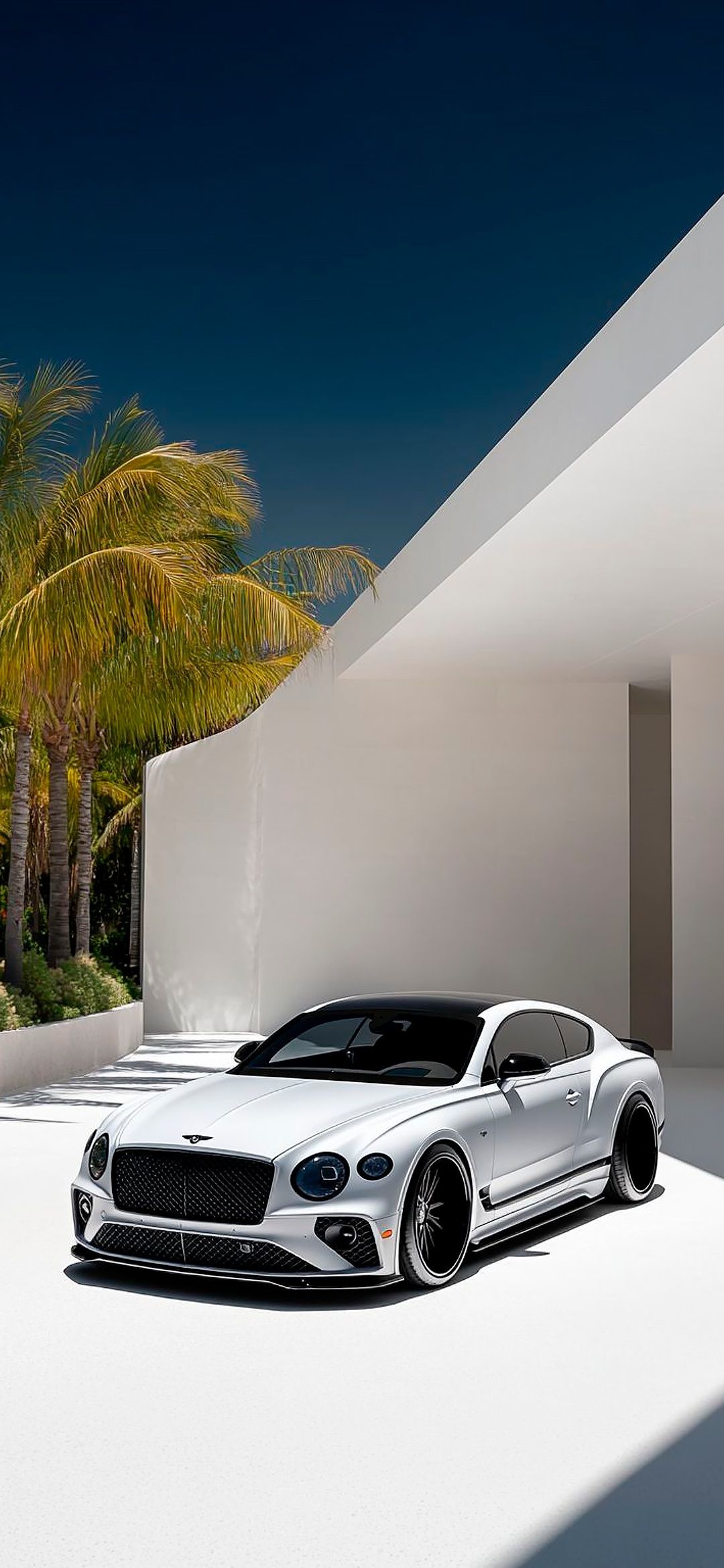 a white sports car parked in front of a building with palm trees and blue sky