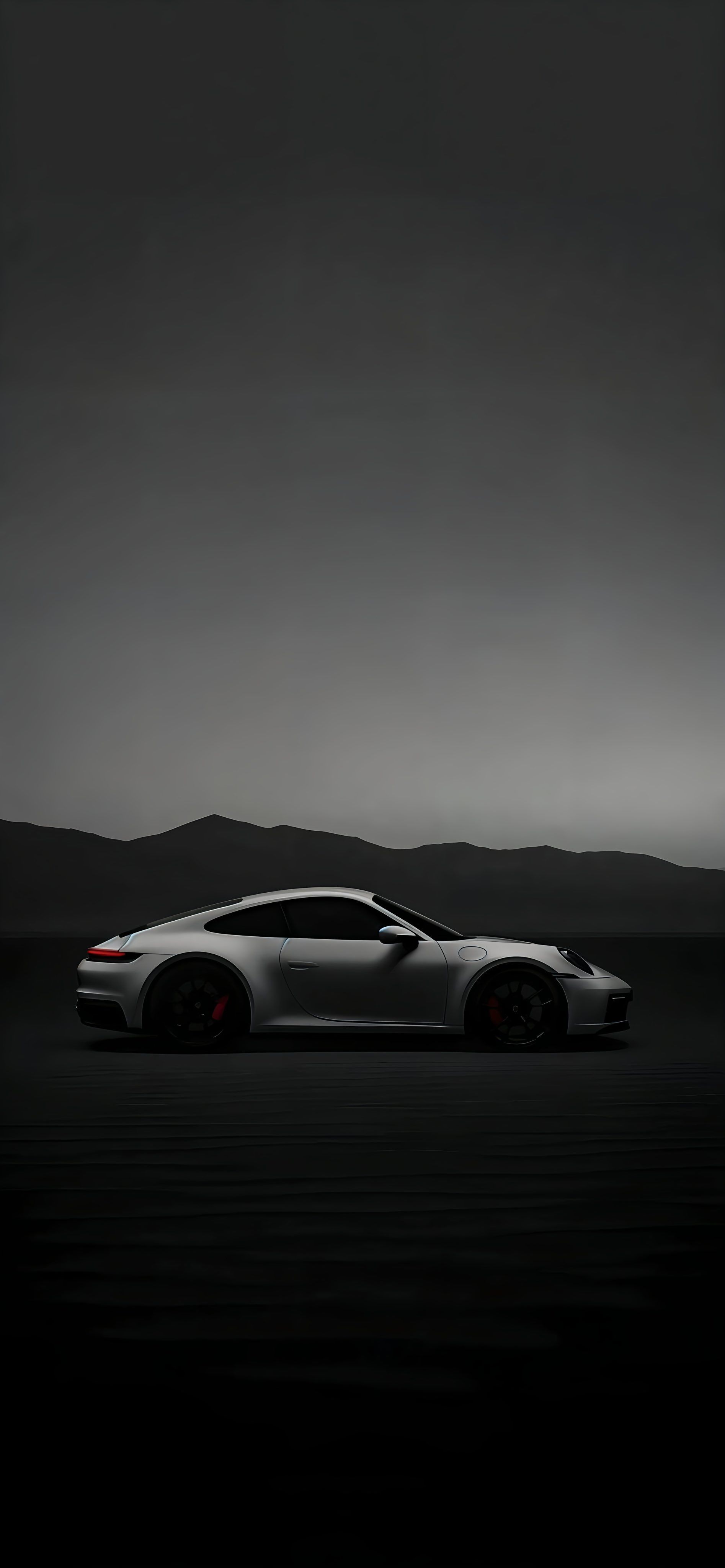 a white sports car parked in the dark