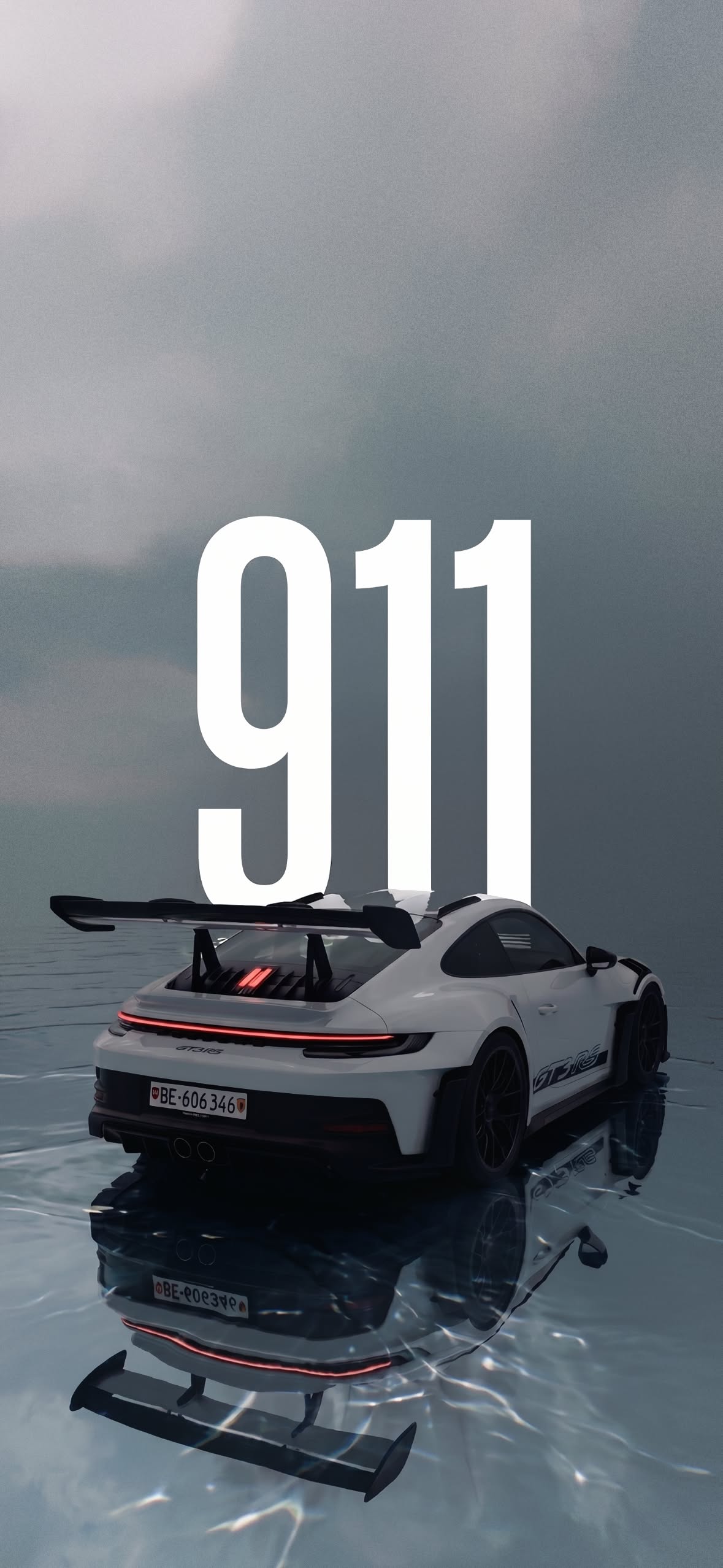 a white sports car sitting on top of a body of water