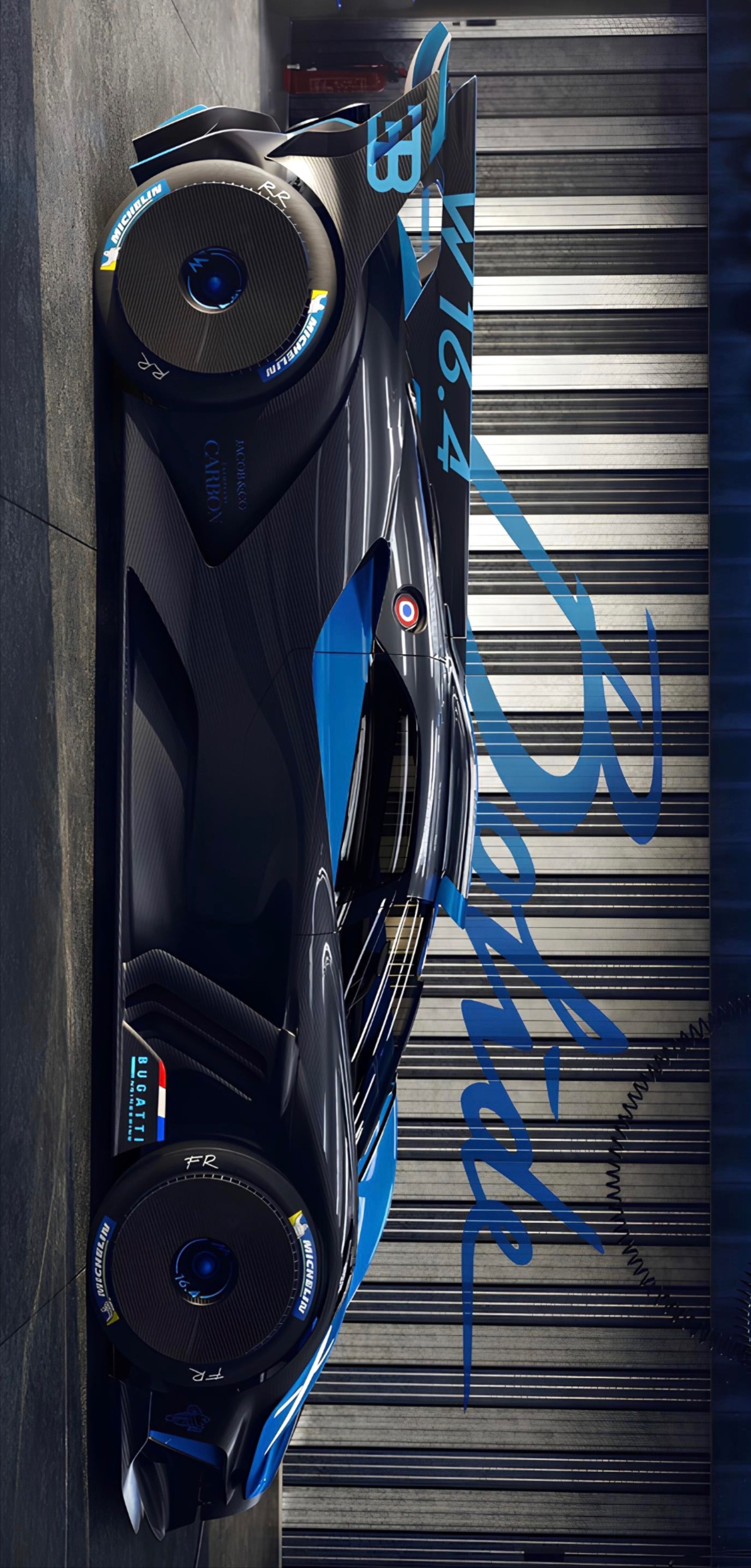 the futuristic car is parked in front of a garage door