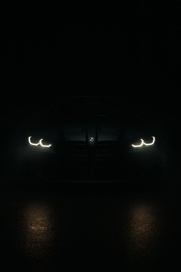 the headlights of a sports car are glowing in the dark