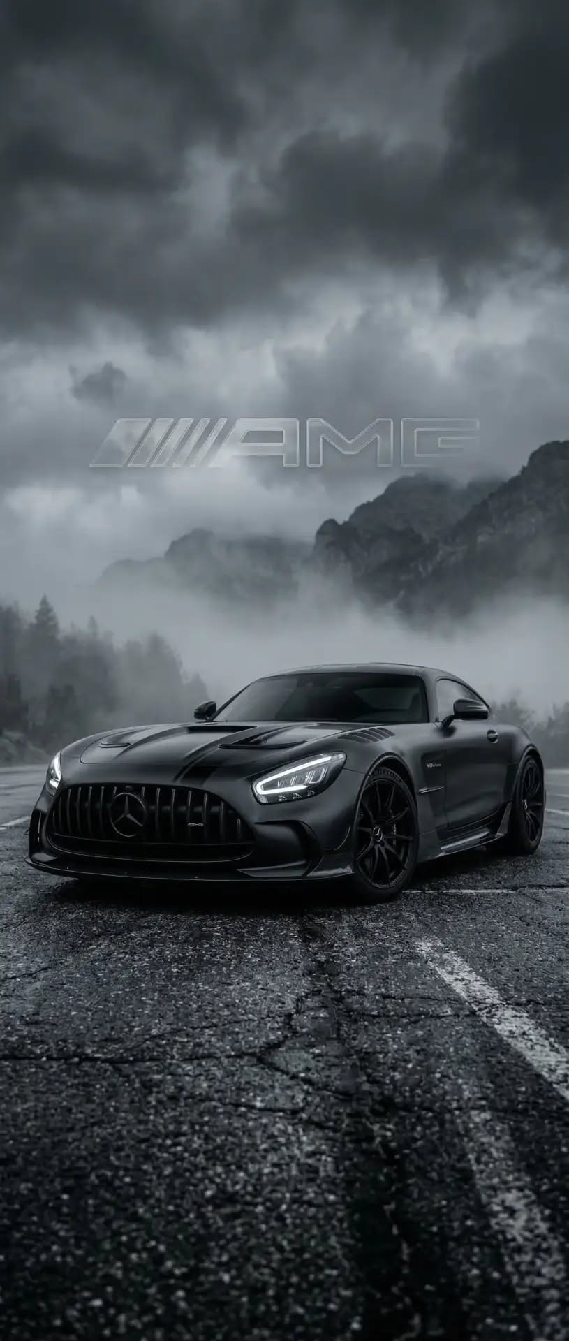 the mercedes amg gtr is shown in front of a dark sky with clouds