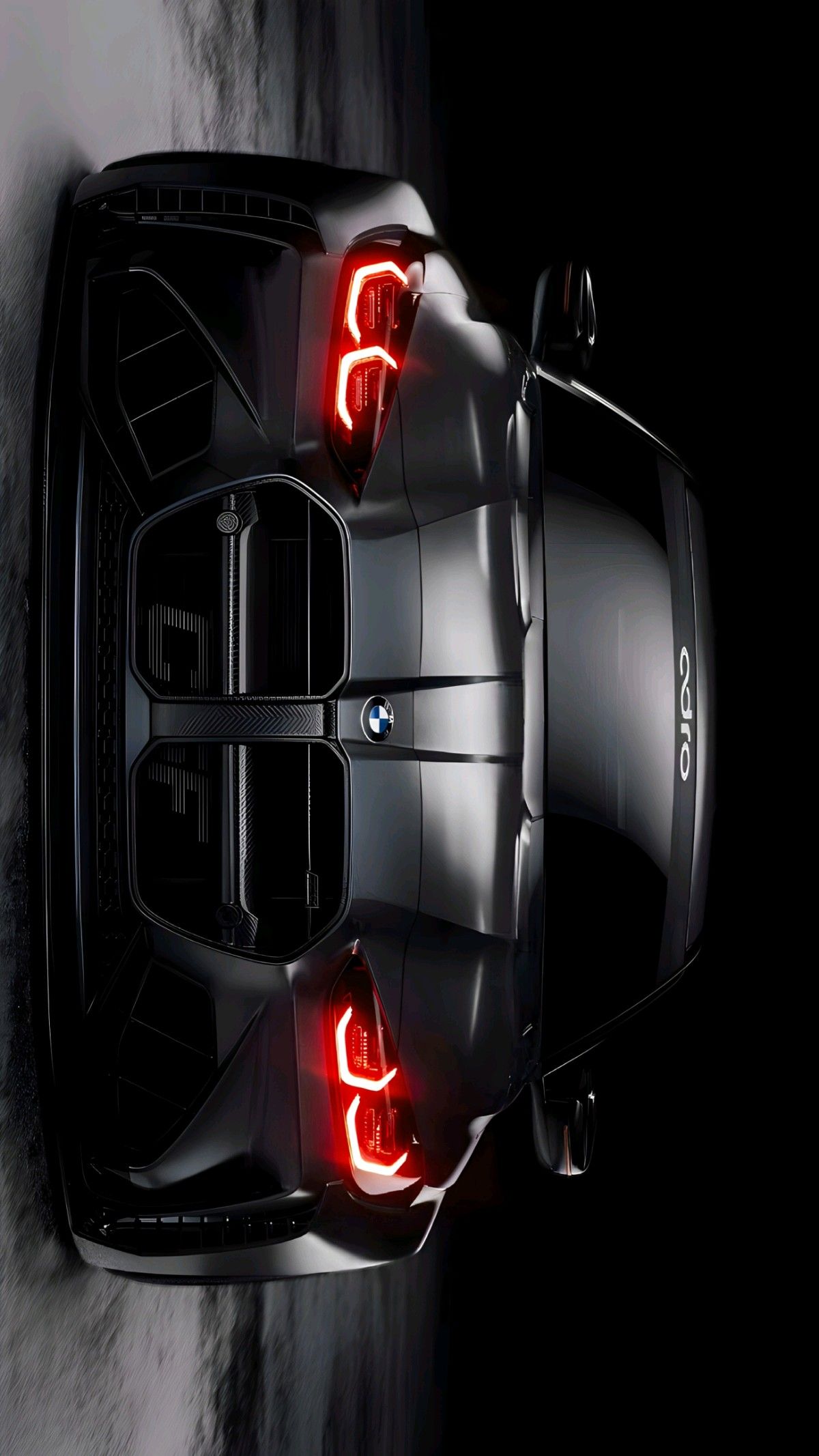 the rear end of a black sports car with red lights on it's hood