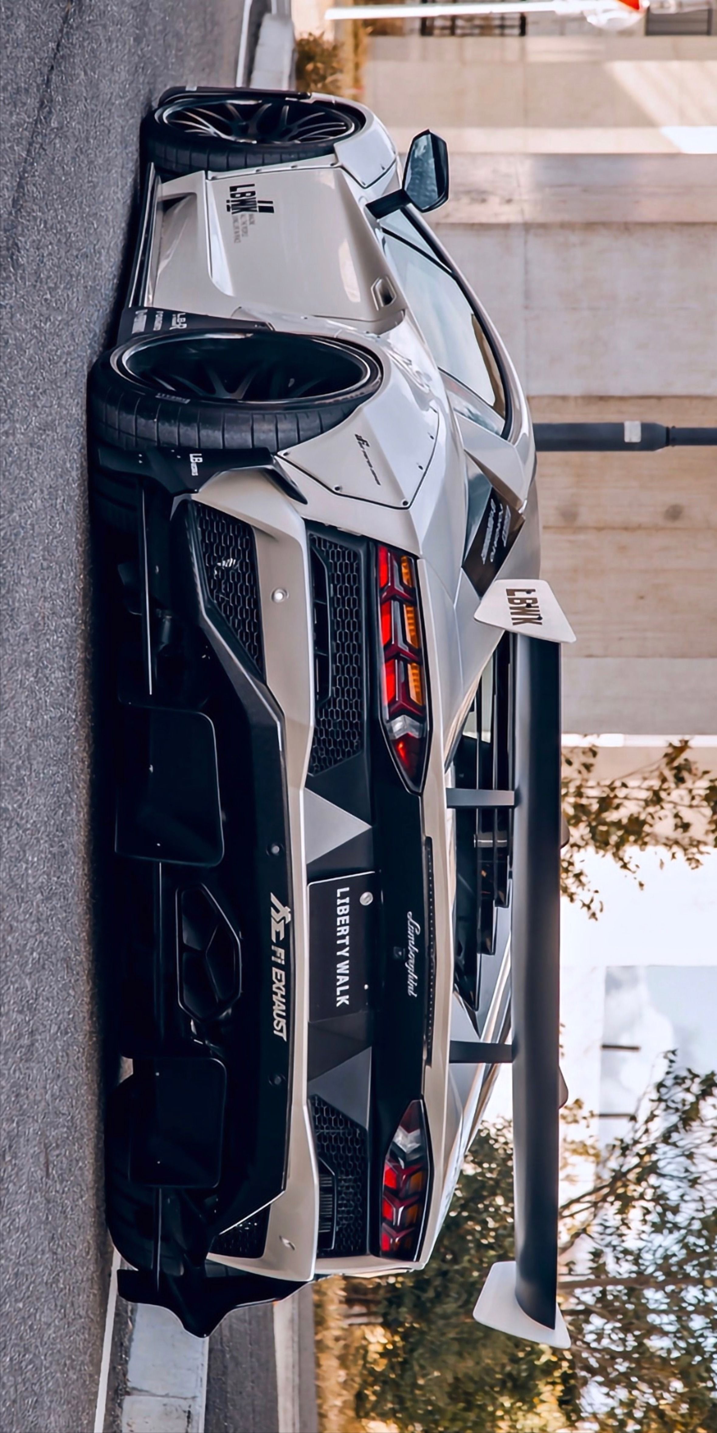 the rear end of a white sports car