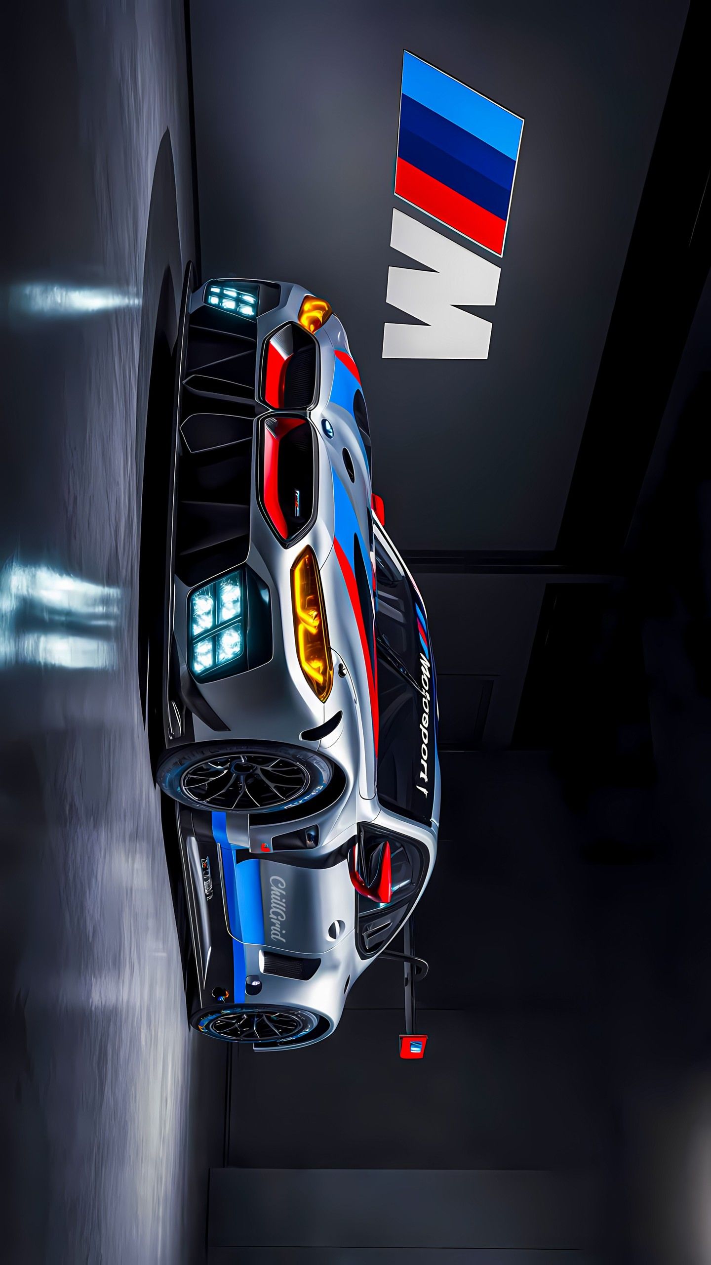 the top view of a race car in a dark room with an bmw logo on it