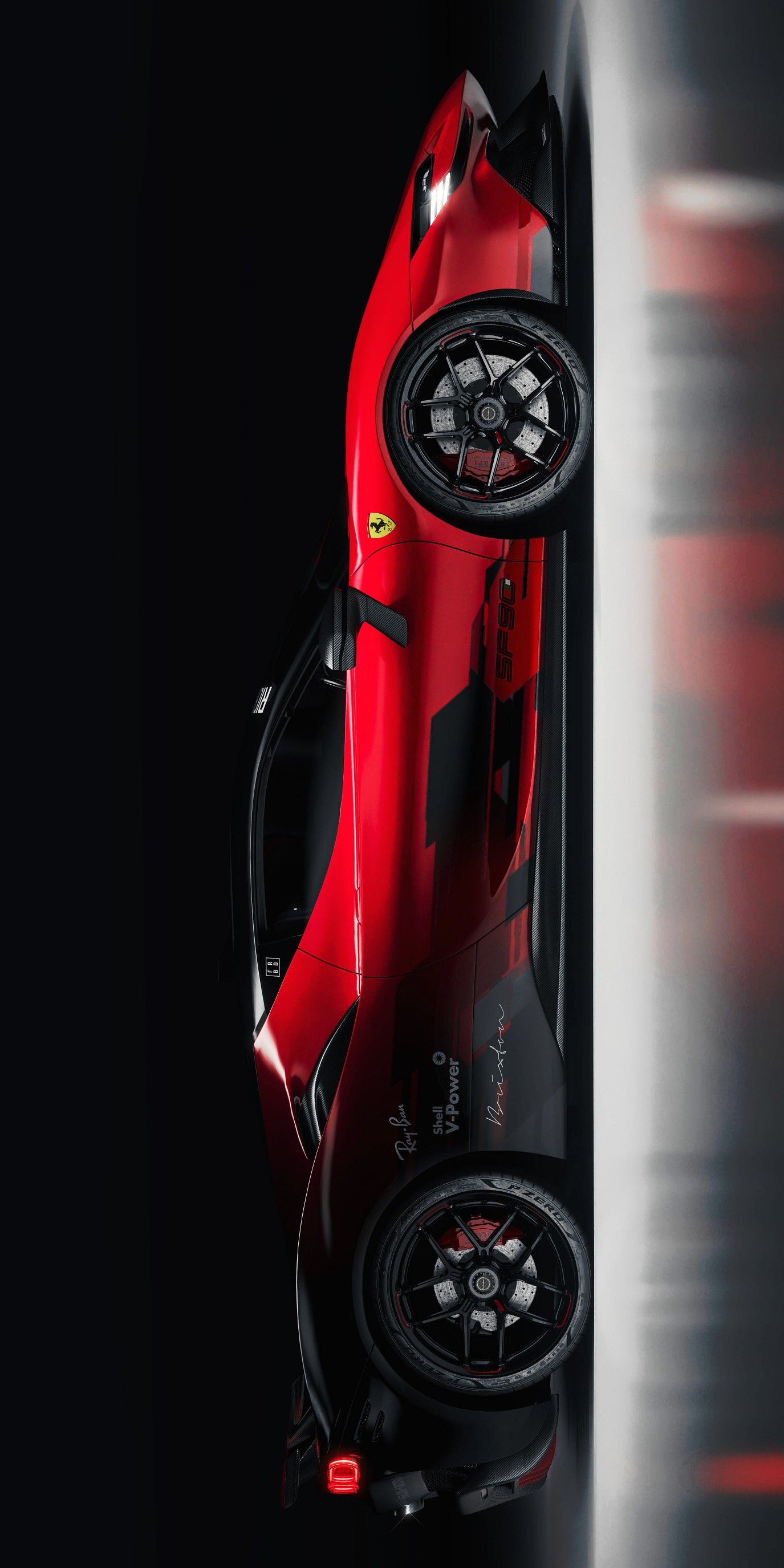 the top view of a red sports car with its wheels on it's side