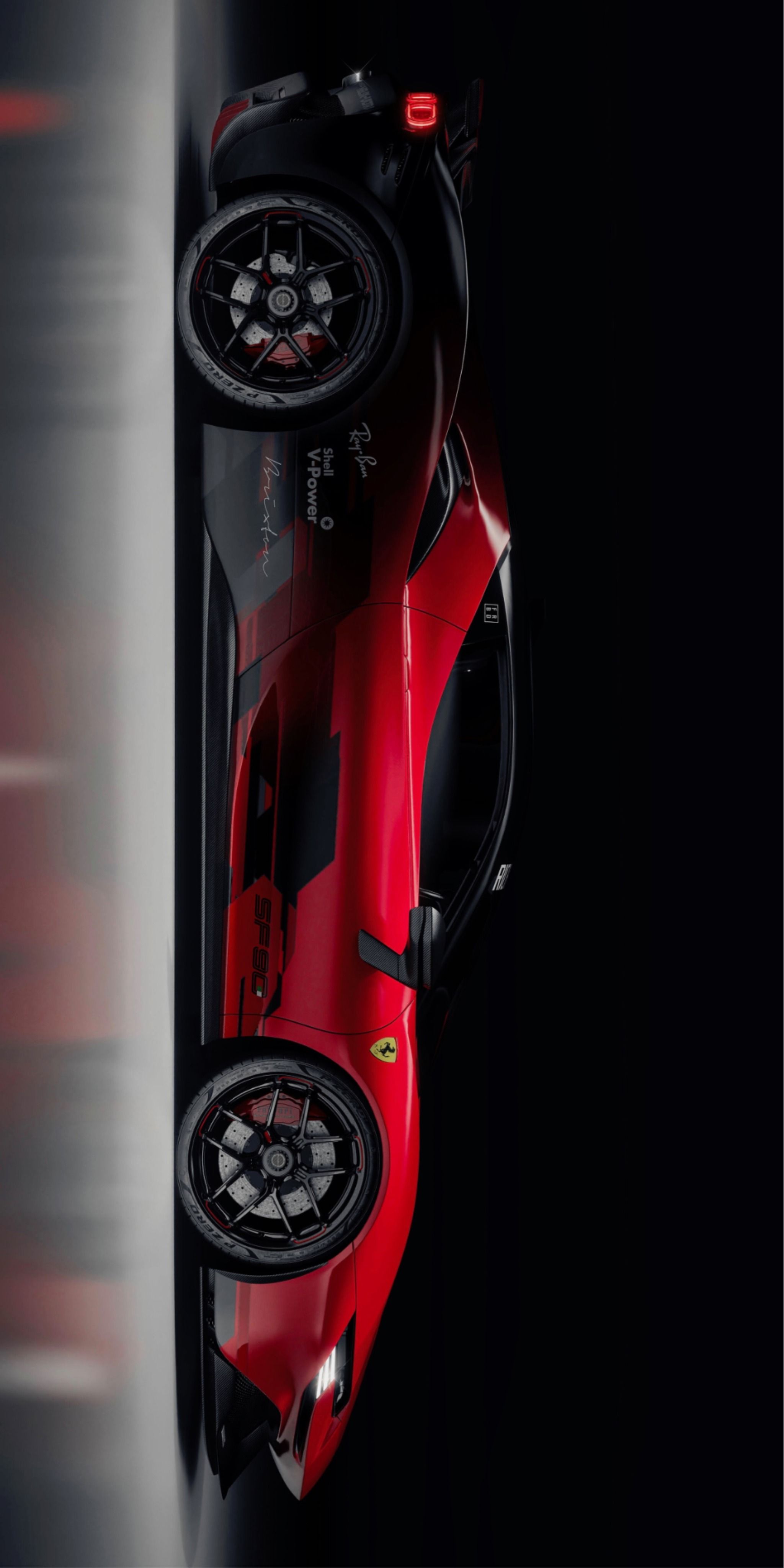 the top view of a red sports car with its wheels on it's side